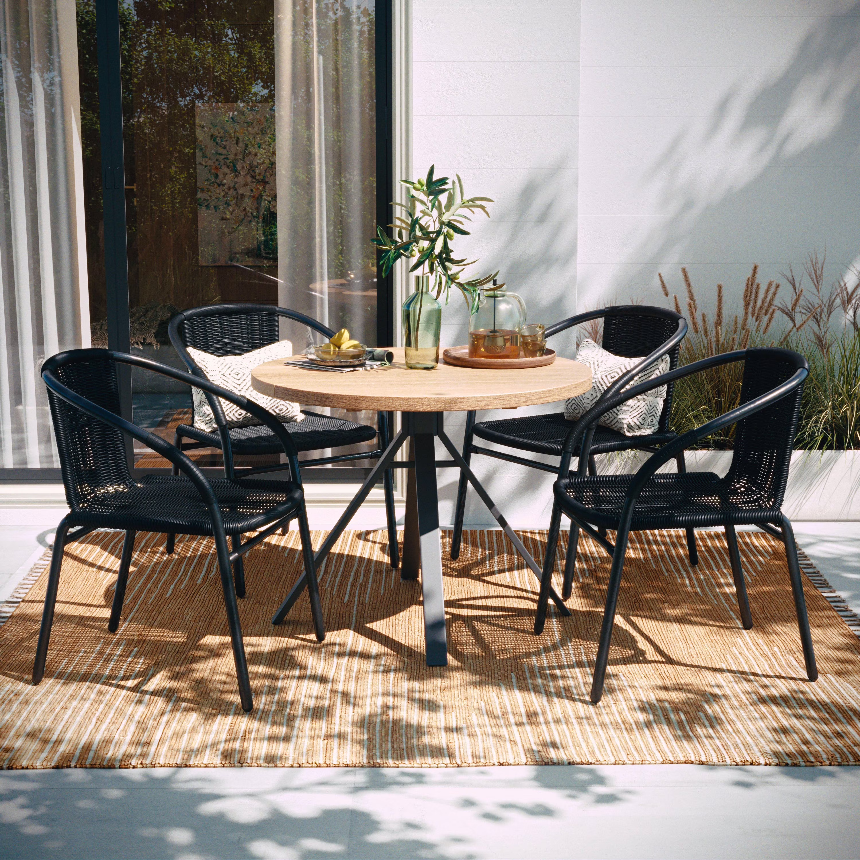 Emma + Oliver 4 Pack Black Rattan Indoor-Outdoor Restaurant Stack Chair with Curved Back